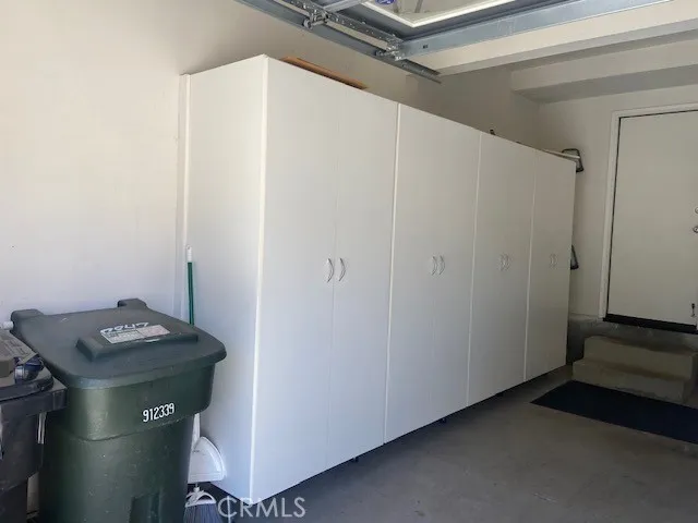 Door to Interior of Property, Wall of Storage Cabinets.