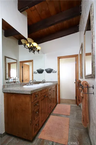 Main bath, double sinks and linen closet