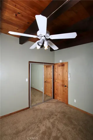 Bedroom.  Ceiling fan, mini-split unit and beautiful view windows.