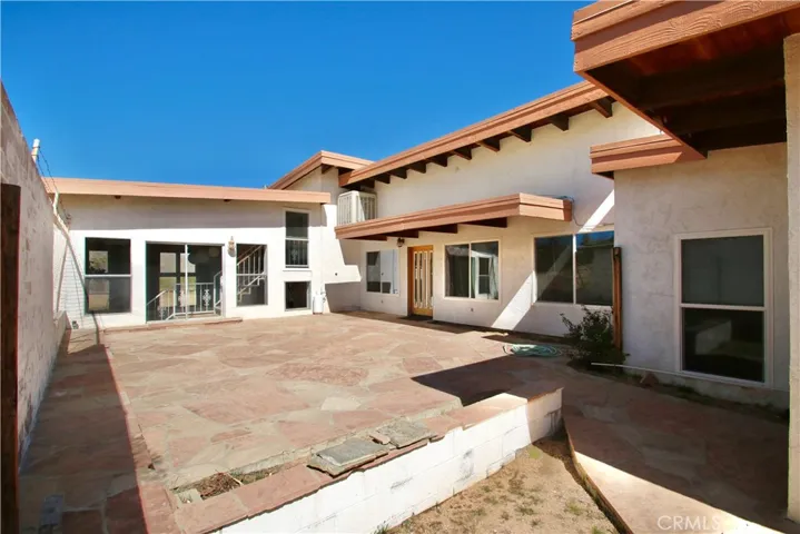 Back patio area with access the pool