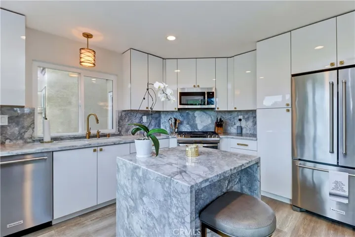 Completely remodeled kitchen with marble counter tops.