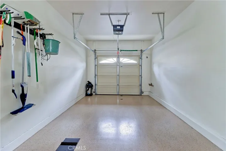Attached 1 car garage with epoxy flooring.
