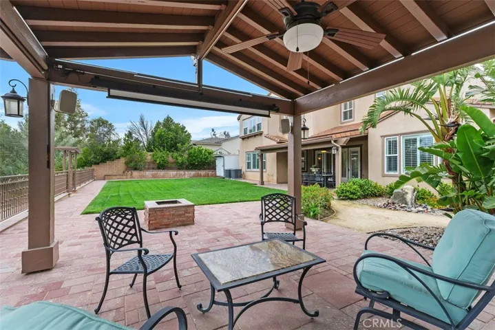 gazebo with ceiling fan, movie projector, and speakers