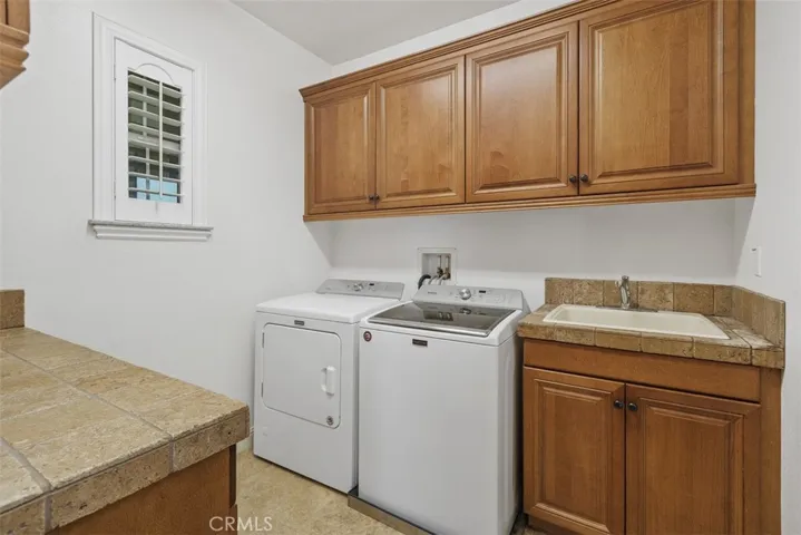Laundry room with utility sink