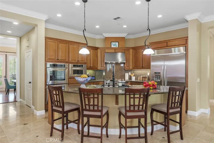 Kitchen with stainless steel appliances and granite island