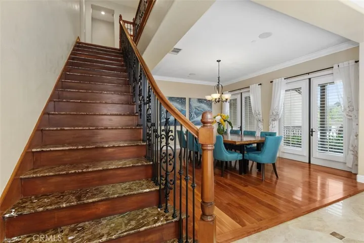 Staircase with wrought iron stair railing