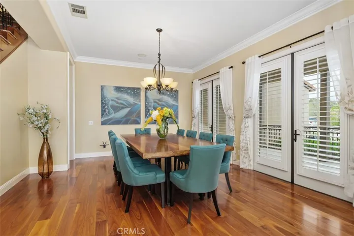 Formal dining room with two double French doors