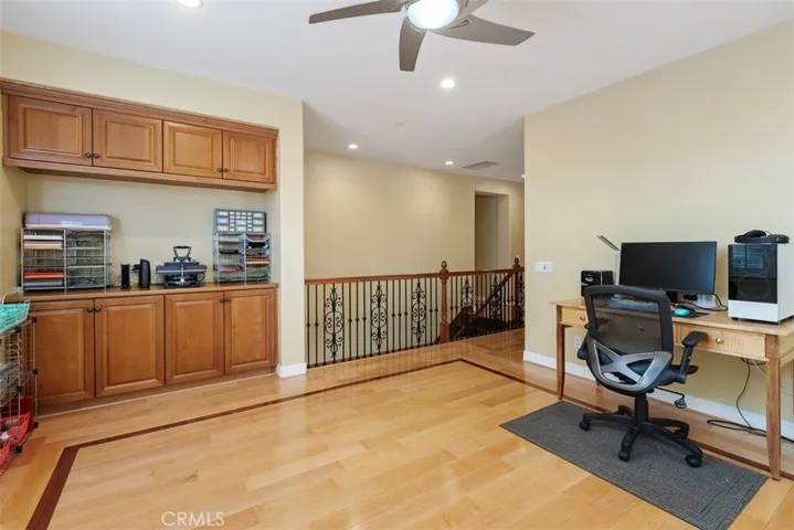 Upstairs loft with ceiling fan