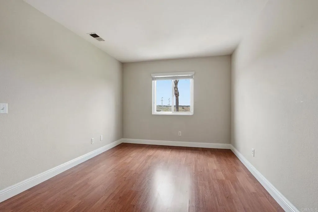 Upstairs bedroom with walk-in closet and hillside views