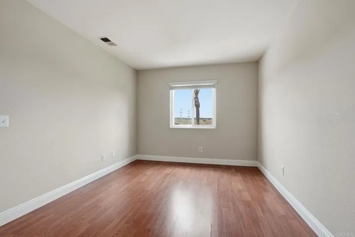 Upstairs bedroom with walk-in closet and hillside views
