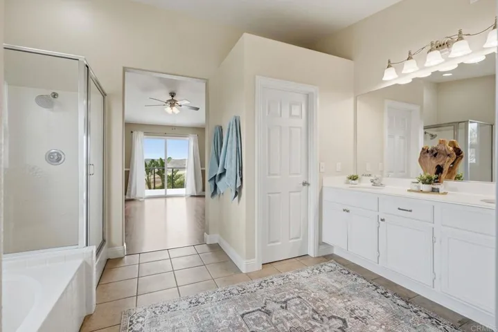 Primary bathroom with private WC and double vanity