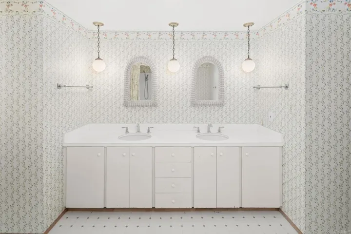 Interior of bathroom number 2.  Jack n'Jill bath for bedroom 2 and 3.  Also has door to pool area.