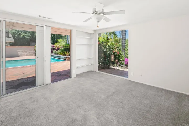 Bedroom 3 with access to pool and private patio