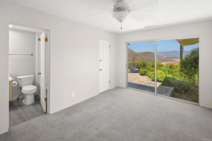 Bedroom with bathroom access and private patio