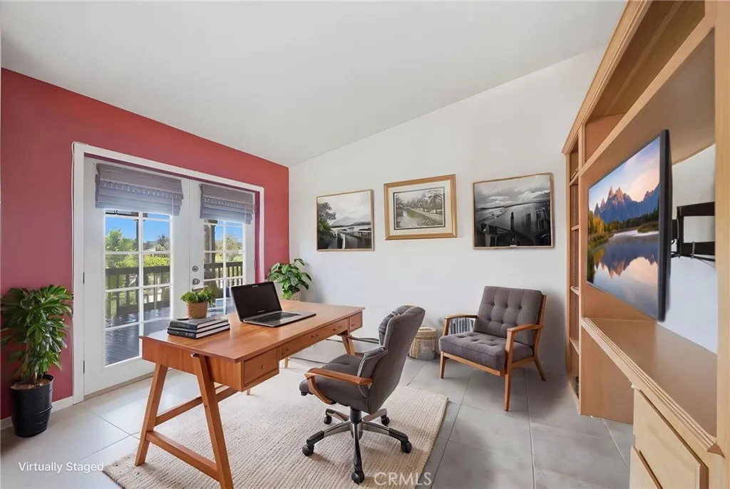 Digitally enhanced/altered view of retreast space off the primary bedroom w dual french doors leading to back patio.