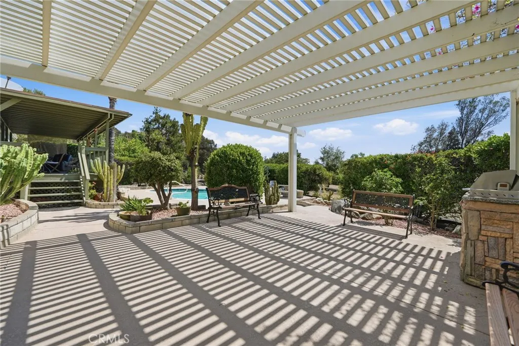 Additional patio space adjacent to pool
