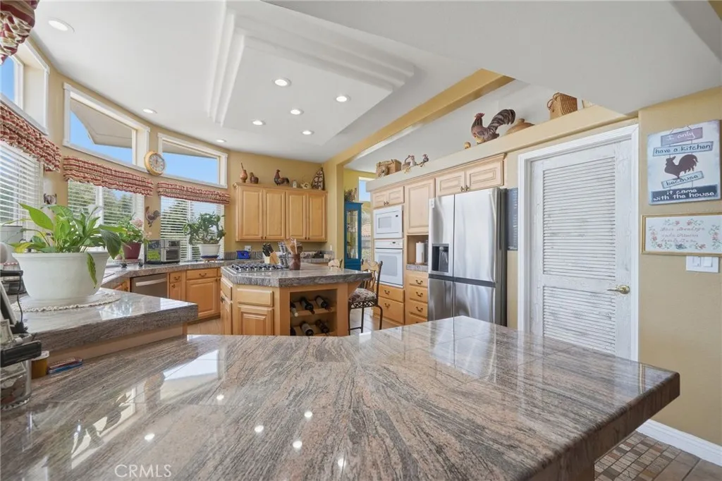 Breakfast bar w door to walk in pantry at right