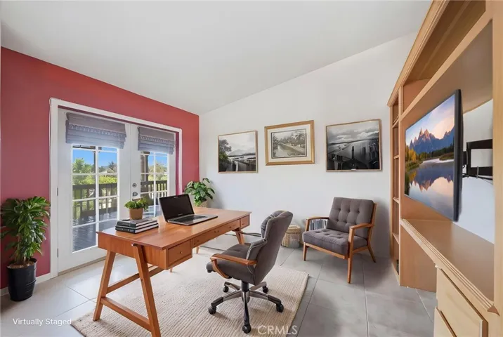 Digitally enhanced/altered view of retreast space off the primary bedroom w dual french doors leading to back patio.