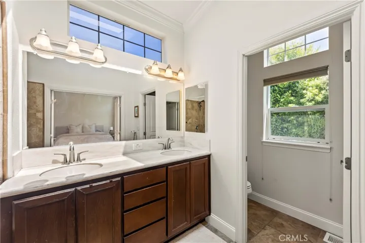 master bathroom with double sink, and plenty with plenty of windows, bright and airy for everyday comfort