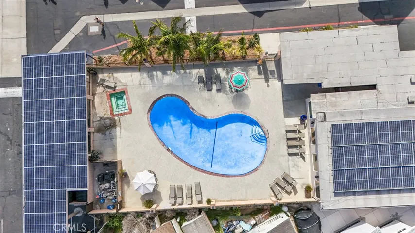 community pool view from above, highlighting resort style settling and outs amenities