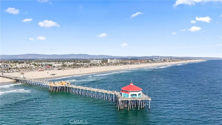 photo featuring the famous Huntington Beach pier and the ocean. home of the world-famous surfing contest held every year