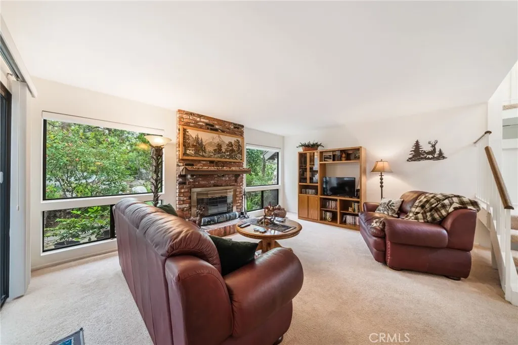 Relax and enjoy the view and cozy up to your built in brick fireplace