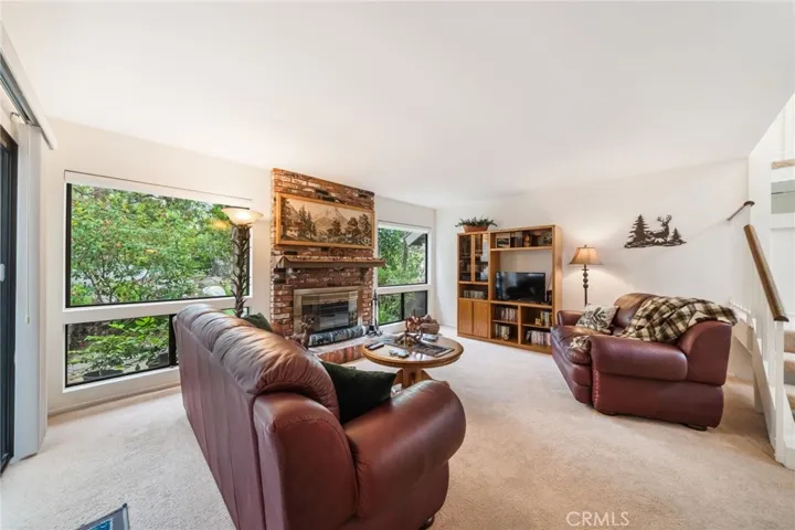 Relax and enjoy the view and cozy up to your built in brick fireplace