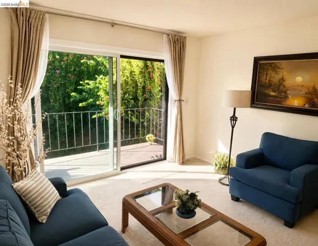 Sliding glass doors opening to an exterior balcony with metal railing
