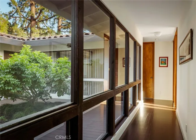 Upstairs hallway with walls of glass
