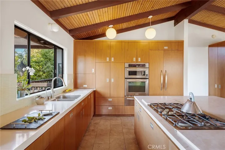 Walnut cabinetry, built-in refrigerator
