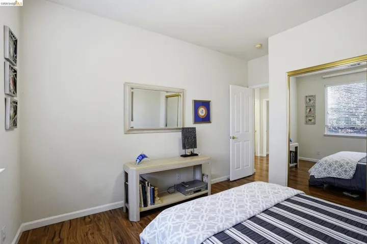 Bedroom featuring wood-finish flooring