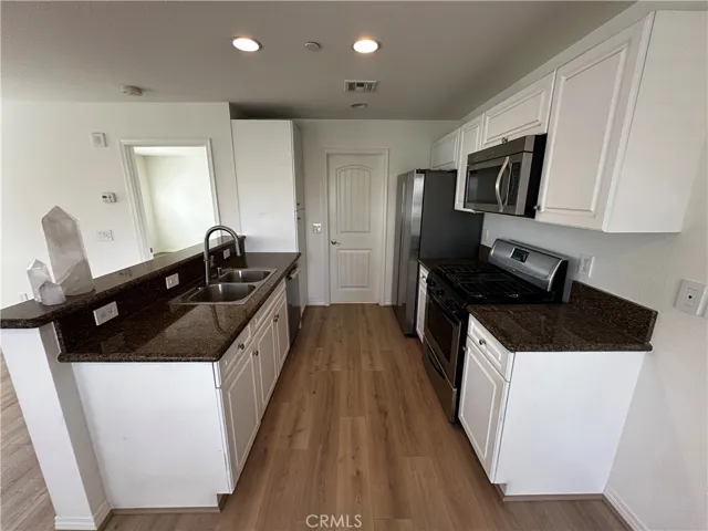 Kitchen with access to bathroom