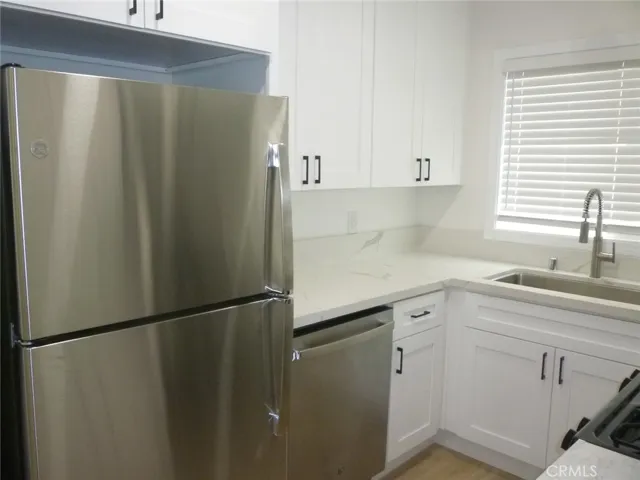 Another view of the kitchen with all new appliances.