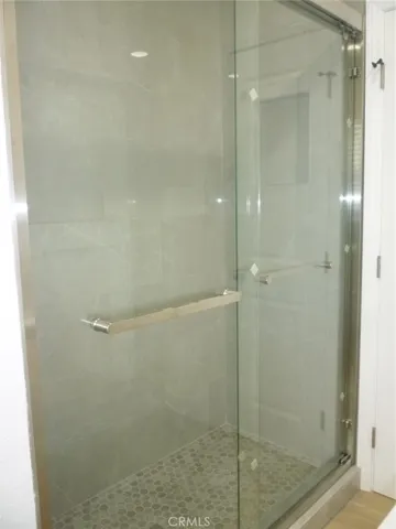 New walk-in shower with sliding shower doors.