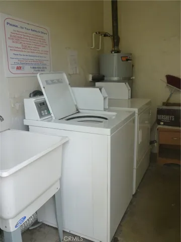 Community laundry room shared amont the four units in this complex.