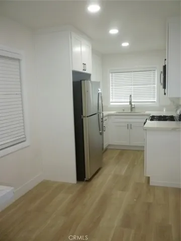 View of the completely renovated kitchen as seen from the living room.