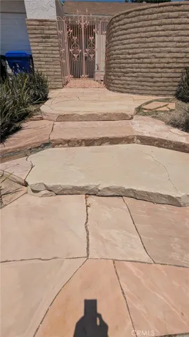 Steps going to gate and front door