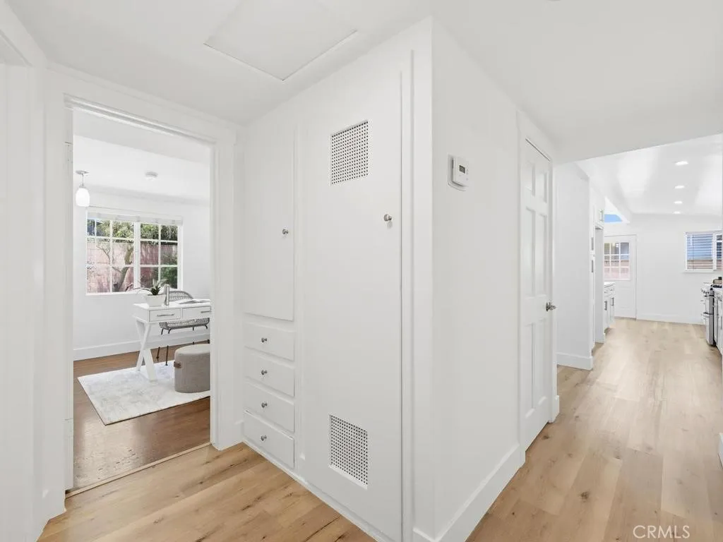 Hallway with closet and linen drawers