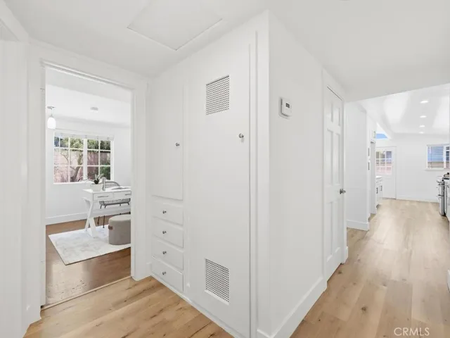 Hallway with closet and linen drawers