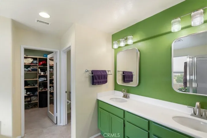 Main en suite bathroom with heated mirrors