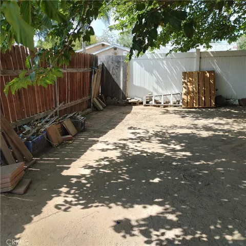 vinyl fence on North wall