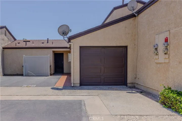Single story condo with single car garage plus carport