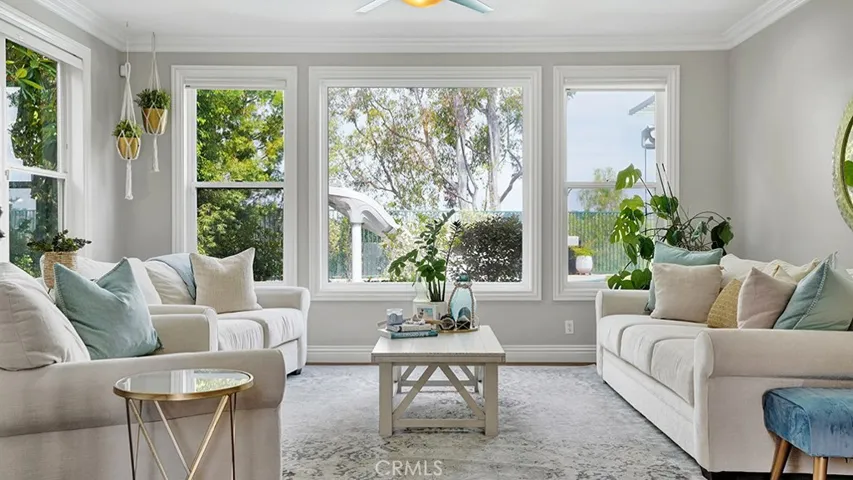 Formal Living Room overlooking pool yard + views.