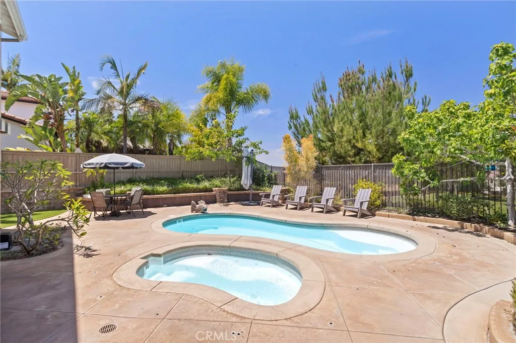 Resort-style pool and spa create a private backyard retreat