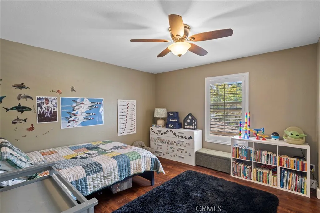 Generous space and natural light enhance the bedroom's appeal
