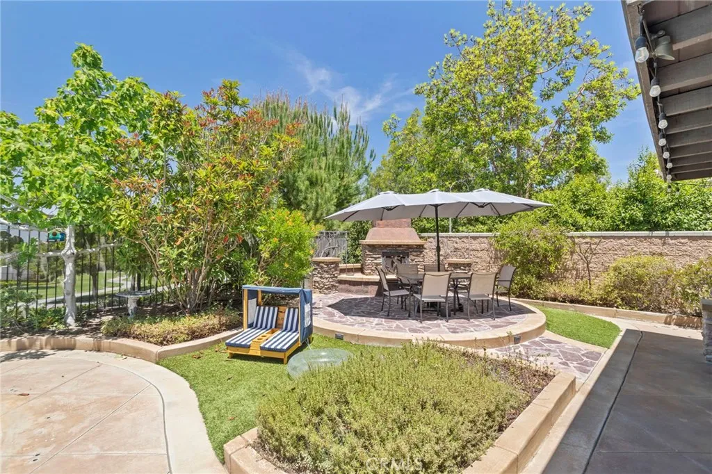 Mature trees and lush landscaping create a peaceful outdoor setting
