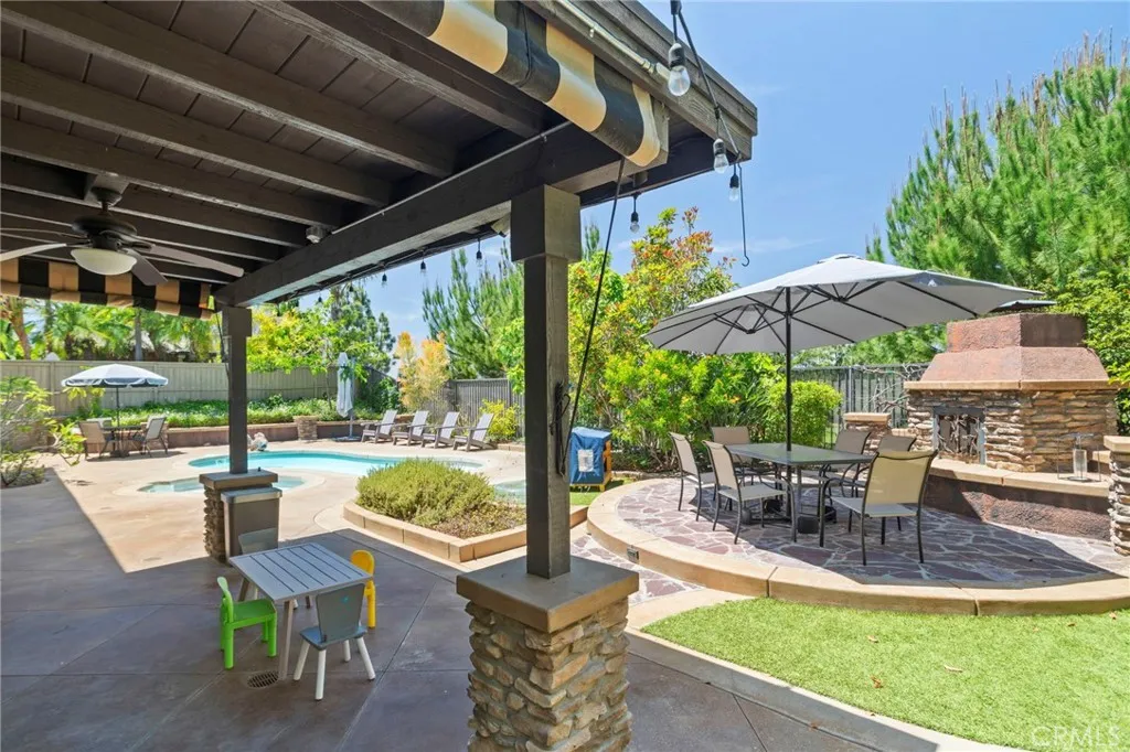 Fireplace-centered patio creates a warm and welcoming gathering space