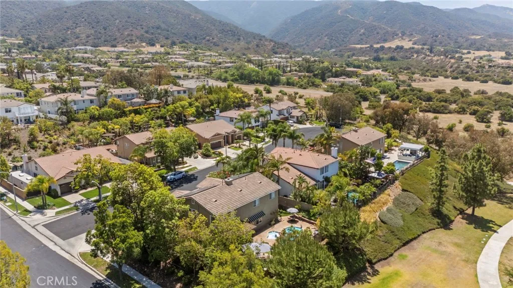 Located in a charming community with tree-lined streets and stunning hillside views