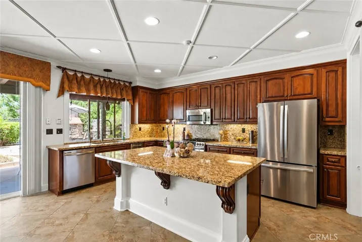 Stainless steel appliances add a modern touch to the well-appointed kitchen