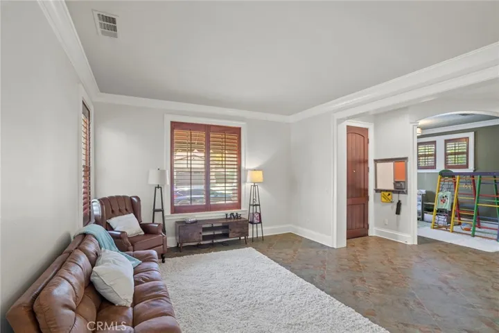 The living room opens to a versatile bonus area